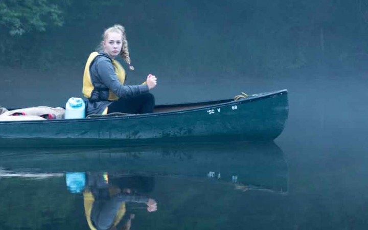 girls learn canoeing skills on outward bound course